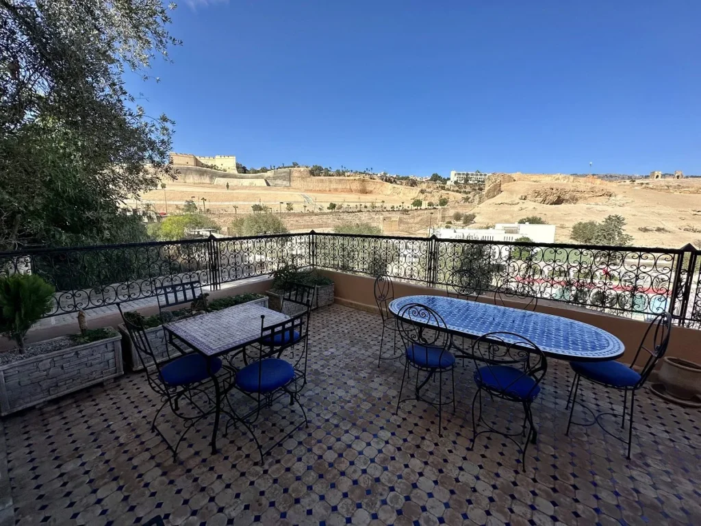 Lower terrace with North Borj and Marinid tombs Riad Layalina Fes