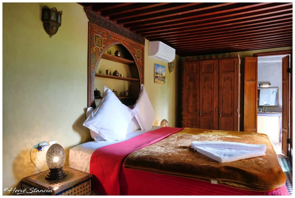 Superior double room king size bed at Riad Layalina Fez